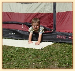 Kid in tent camping.