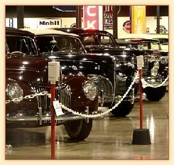 Rows of vintage cars on display at an automotive museum