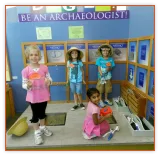 Kids dressed up at a Be an Archaeologist exhibit
