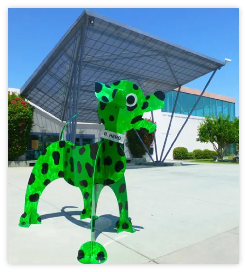 Green spotted dog sculpture outside the Children's Discovery Museum of the Desert